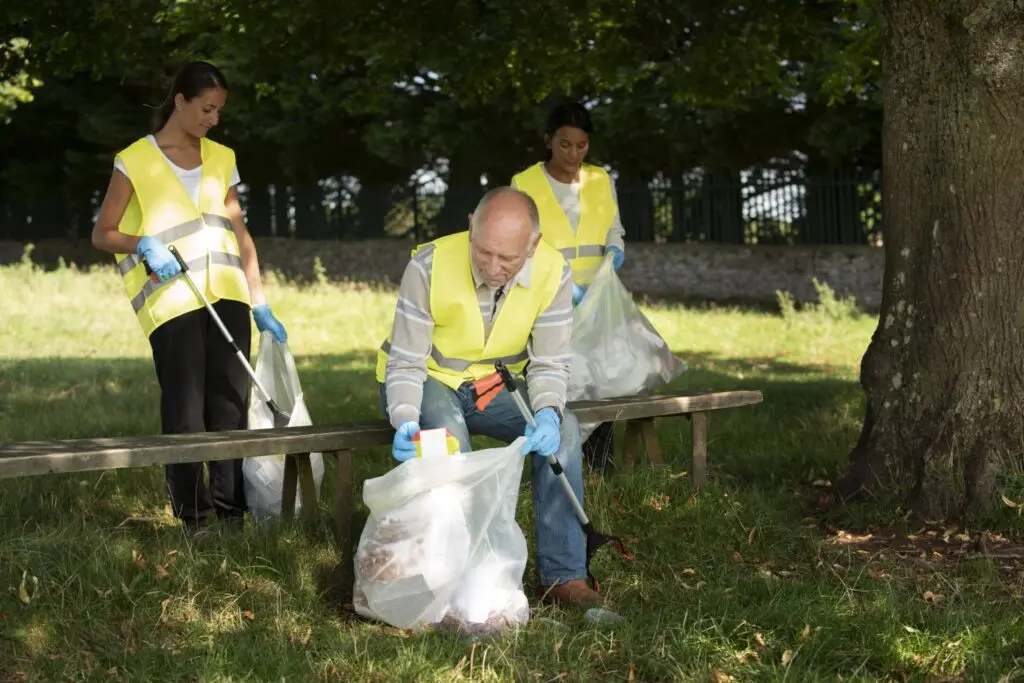 People doing community service by collecting trash nature