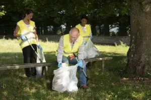 People doing community service by collecting trash nature